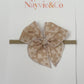 RTS MINI NEUTRAL DAISY CHECK ON NYLON Fable Bow